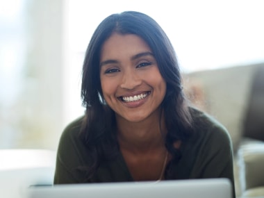 photo of virtual assistant sitting at a desk with headphones on