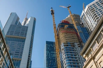 Skyscrapers under construction representing scalable and evolving enterprise structures
